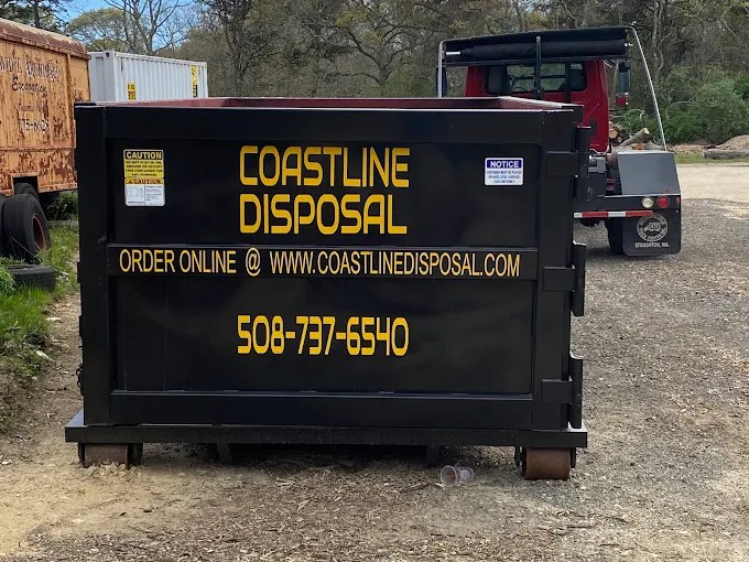 Rear of a Coastline Disposal dumpster showing order-online, website, and 508-737-6540